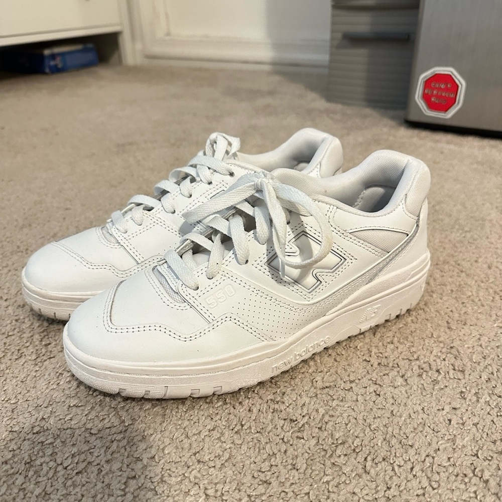 All white New Balance 550s